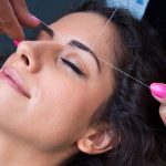 Threading being performed on eyebrows