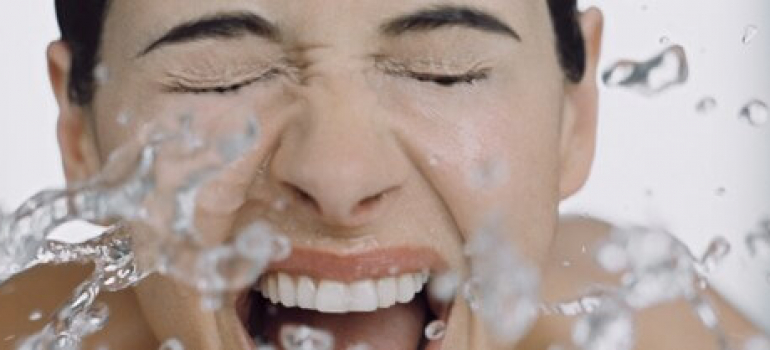 Girl Splashing face with water