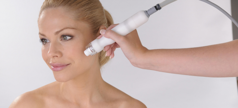CACI Ultra Facial being performed on blonde female client face