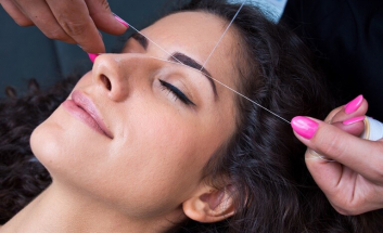 Threading being performed on eyebrows